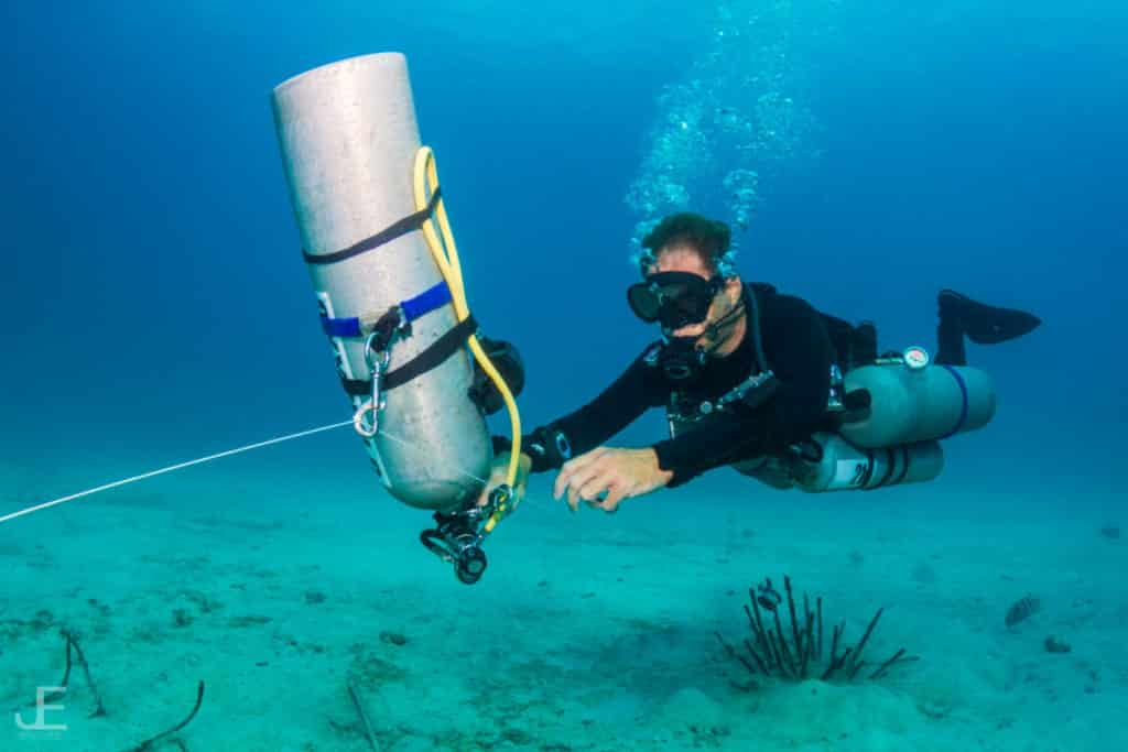 sidemount diver practising stage-handling techniques, an important part of technical diving