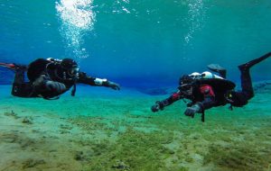 TDI articles written by Richard Devanney outline decompression theory. Two divers at Silfra fissure undertaking a safety stop must obey the rules governing offgassing of nitrogen to minimise their risk of decompression sickness